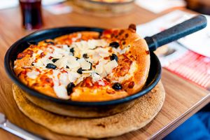 Pan pizza on restaurant table